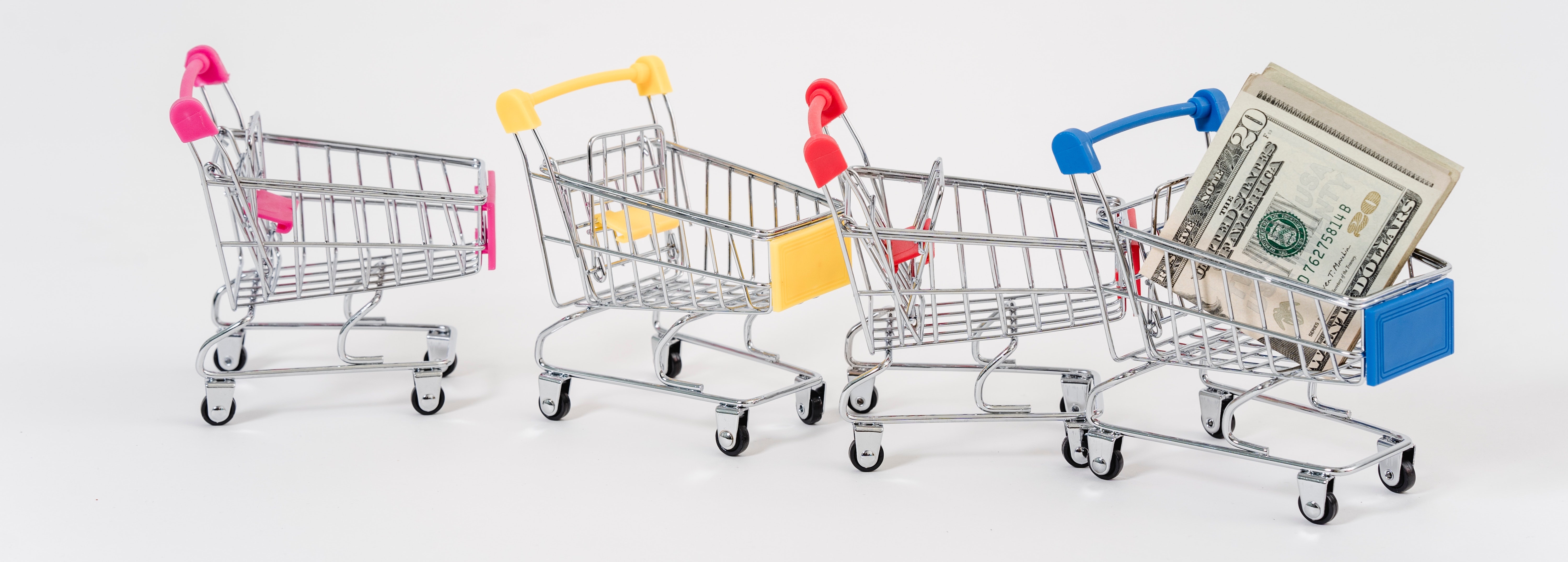 Mini shopping carts on a blank background
